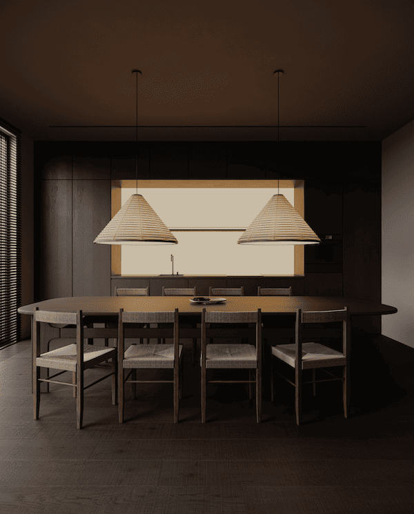 Пространство кухни-гостиной, стол овальной формы, деревянные стулья, два подвесных светильника-конуса над столом, встроенная кухонная мебель