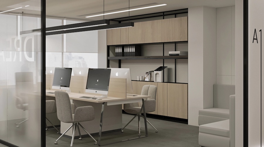 Офисное помещение, стол с мониторами, офисные кресла, угловой диван, шкаф с папками