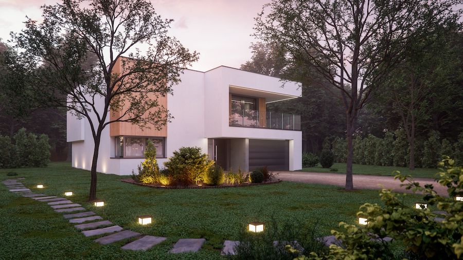 Дом в современном стиле освещен фонарями с минималистичным дизайном