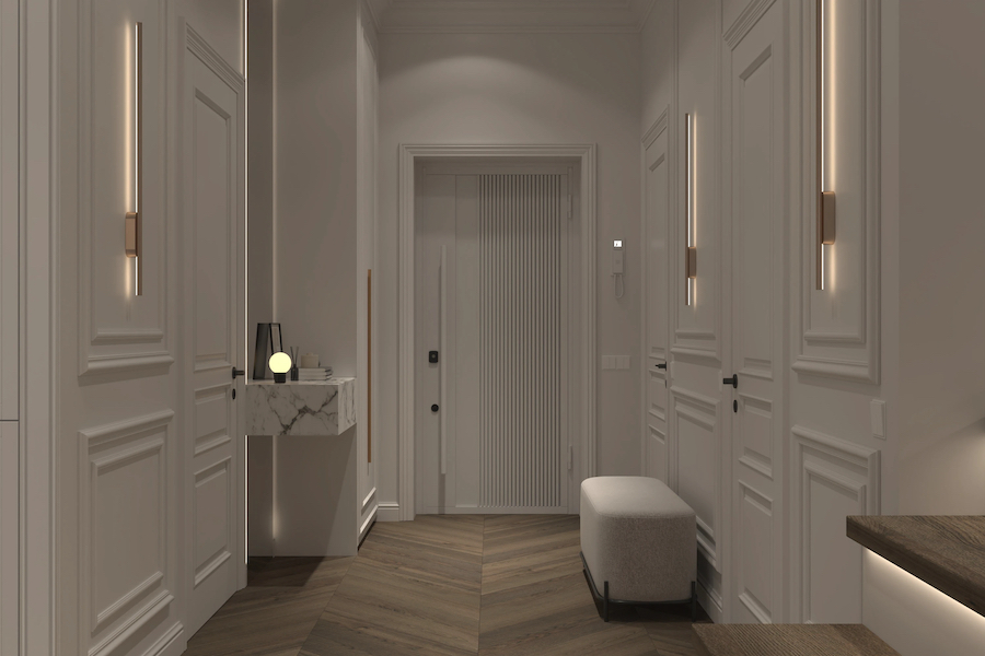 Компактные линейные бра не утяжеляют пространство и визуально увеличивают высоту потолков Пространство коридора и прихожей, светлые стены и двери, каменная столешница со светильником и зеркалом, пуфик, линейные бра на стенах