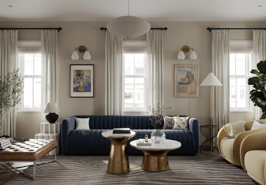 Правильное сочетание настенного освещения с потолочными светильниками и локальными источниками создаёт многоуровневую световую среду Пространство гостиной, три окна со шторами, синий диван, два журнальных столика, два кресла, торшер, настольная лампа, бра, подвесной светильник, две картины, ваза, книги