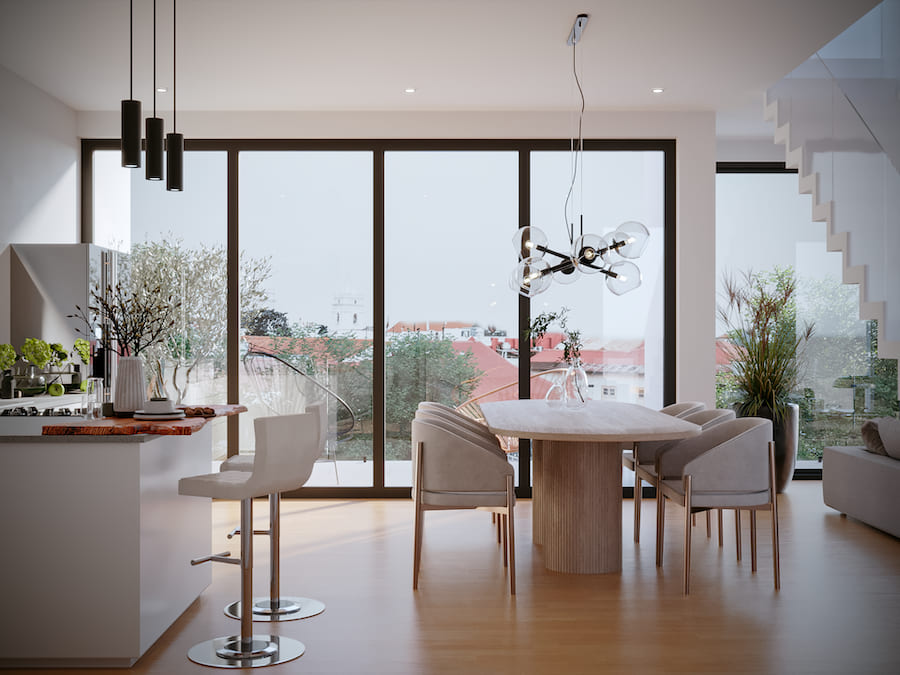 Кухня-гостиная, островок с барными стульями, овальный стол с мягкими креслами, подвесные светильники, встроенные споты, лестница на второй этаж