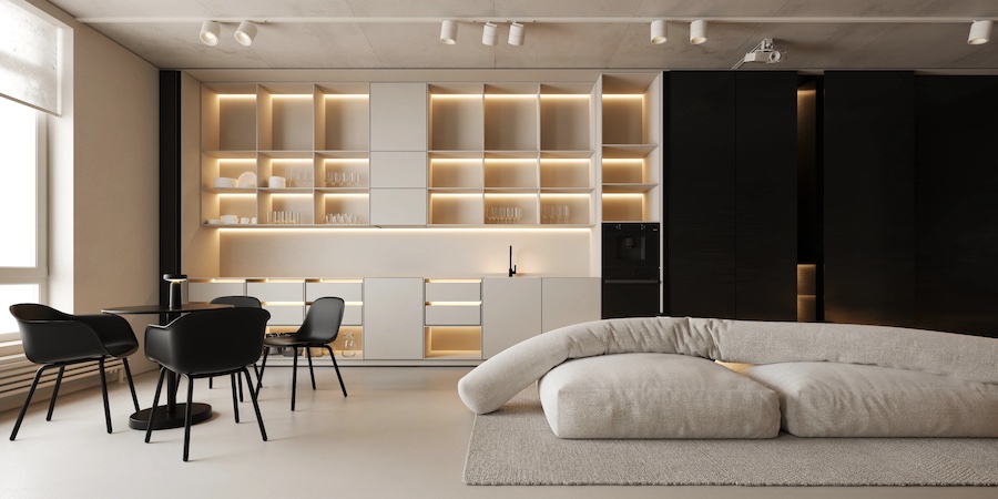 Кухня-гостиная, встроенная мебель кухни закрывается панелями на рейлингах, стол, мягкие стулья, бескаркасный диван из трех подушек