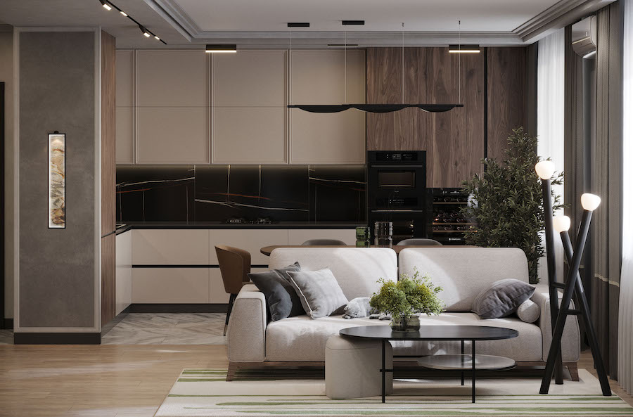 Пространство кухни-гостиной, двухместный диван, журнальный столик, дерево в кашпо, встроенная кухонные шкафы, напольный светильник и трковая система освещения