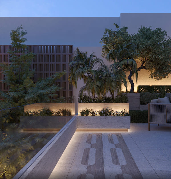 Пространство виллы, растения на фоне светлой стены подсвечиваются LED лентой, кресло с подушками