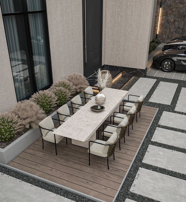 Обеденный стол со стульями на террасе, пошаговые ступени с обсыпкой гравием, две машины, панорамное окно, декоративные кустарники