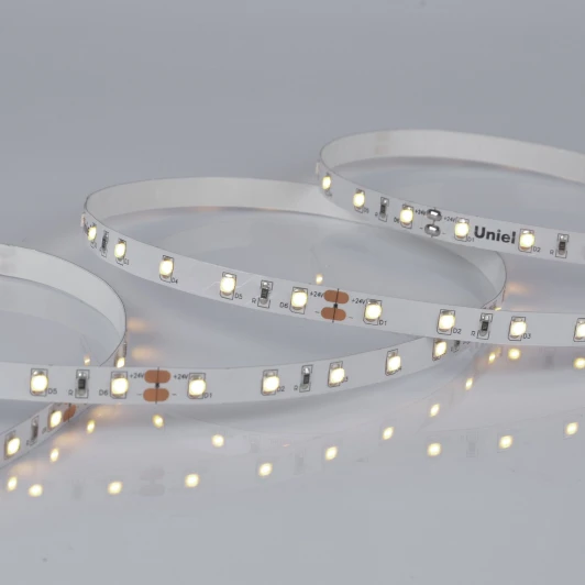 ULS-2835-60LED/m-8mm-IP20-DC24V-6W/m-5M-WW катушка в герметичной упаковке Светодиодная лента Uniel ULS-2835-60LED/m-8mm-IP20-DC24V-6W/m-5M-WW катушка в герметичной упаковке