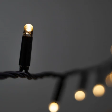 Гирлянда Нить с колпачком 10м тепло-белая 220В, 100 LED, провод черный ПВХ, IP65 Laitcom PST100CAP-11-2WW