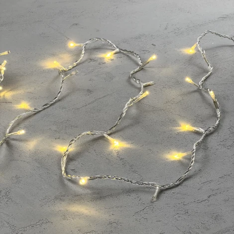 Гирлянда Нить 10м золотой с мерцанием 24В, 100 LED, провод прозрачный ПВХ, IP54 Laitcom PST100BL-10-1GL